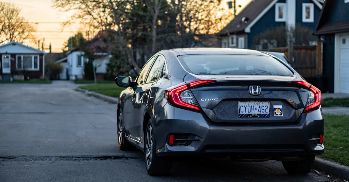 Honda Civic with Ontario plates parked on a Canadian residential street, representing car loan debt relief options.
