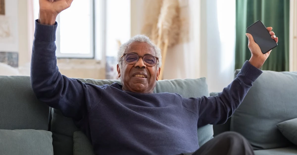 Man celebrating successfully qualifying for a consumer proposal.